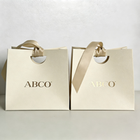 Sac en papier d'emballage cadeau de luxe personnalisé avec logo imprimé, respectueux de l'environnement, pour bijoux, cosmétiques, bougies, parfums, boutiques