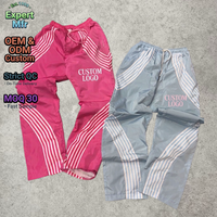 Pantalon de survêtement en nylon rayé surdimensionné Y2K Streetwear avec logo personnalisé OEM pour hommes, pantalon ample vintage à jambes larges, pantalon parachute