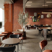 Meubles de salle à manger modernes pour café, table ronde en bois avec chaises à structure métallique et coussins de siège beiges pour restaurant