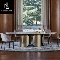 Table et chaise de salle à manger de luxe en acier inoxydable brossé et dessus en marbre artificiel 8 places