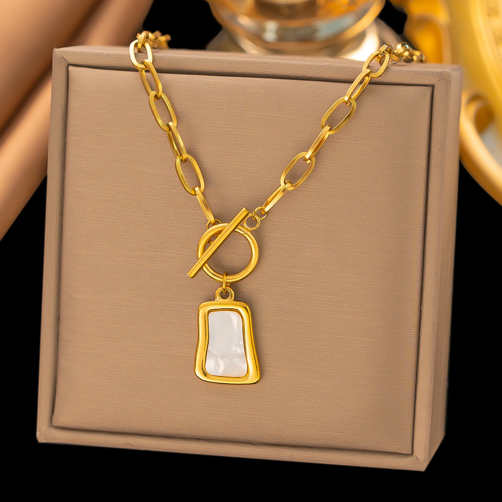 white shell square pendant on OT stainless steel necklace