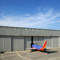 Hangar d'avion en structure acier sur mesure avec portes coulissantes pour le stockage de jets privés dans les immeubles de bureaux et les centres commerciaux