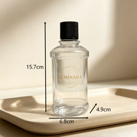Bouteille diffuseur à roseaux en verre transparent avec bouchon à vis nervuré noir, logo LUMINARA doré en relief, conteneur de parfum vide de luxe