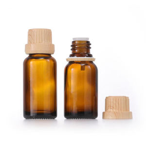 Botella de aceite esencial de vidrio ámbar cosmético con cubierta de madera de bambú falsa de China con tapa de Bambú - Product Image 1