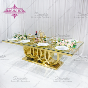 Table à manger élégante en acier inoxydable doré et en verre, idéale pour les hôtels et les mariages - Product Image 1