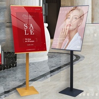 Support publicitaire sur pied pour centre commercial avec panneau d'affichage rotatif en fer pour affiches promotionnelles, style minimaliste moderne