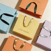 Ruban en gros OEM de couleur unie en gros-grain imprimé avec logo personnalisé, poignée en corde et embouts métalliques