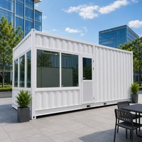 Maison préfabriquée à ossature en acier blanc avec panneaux muraux entièrement vitrés et porte à charnières, prête à l'emploi pour usine, entrepôt ou livraison rapide.
