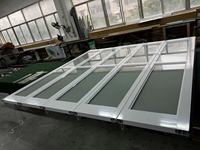 Prix de gros Porte de garage sectionnelle électrique à cadre en aluminium blanc à panneaux en verre trempé