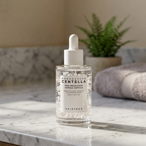 SKIN1004 มาดากัสการ์ เซนเทลล่า โทน ไบรท์เทนนิ่ง แคปซูล แอมพูล 50 มล. แอมพูลบำรุงผิวหน้าจากเกาหลี ช่วยให้ผิวกระจ่างใสและชุ่มชื้น - Product Image 1