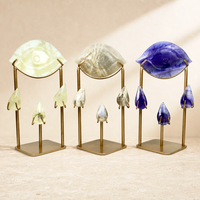 Vente en gros de nouveaux modèles d'œil d'Horus en cristal naturel sculpté, artisanat en cristal avec support métallique pour la décoration et les cadeaux