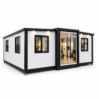 Maison modulaire préfabriquée blanche avec structure noire et portes doubles en verre pour projets résidentiels