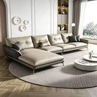 Ensemble de canapés d'angle en cuir véritable confortable et personnalisé de style européen, avec des pieds en métal doré élancés
