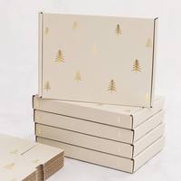 Caja de Cartón Corrugado para Envíos con Logotipo Personalizado, Ecológica, Hecha con Materiales Reciclados, Impresa con Copos de Nieve Navideños en Blanco y Verde