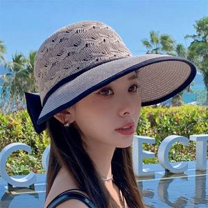 Chapeau de soleil pliable en paille tressée avec nœud ajouré pour femme – Vente en gros - Product Image 4