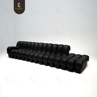 Sofá Seccional Modular Personalizable en Forma de Serpiente, Totalmente Negro, de Cuero Genuino, Patas de Acero Inoxidable, Diseño Moderno para Villas