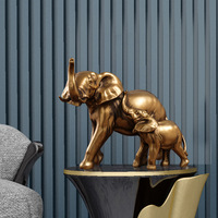 Figurine d'éléphant en résine dorée de style antique moderne, avec un tronc surélevé, statue d'animal pour la décoration de table intérieure