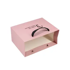 Luxury Pink Ribbon Handle Cardboard Shopping Packaging Bag Customized Embossed Gold Foil Paper Gift Bags With Logo