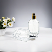 Fabricant sur mesure vente en gros 50ml 100ml atomiseur de pulvérisation en forme de cylindre rond fantaisie bouteille en verre de parfum vide