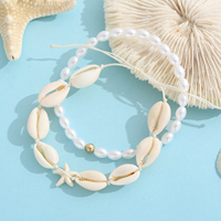Cheville ajustable faite à la main avec coquillages cauris, perles et breloque étoile de mer – Cadeau de plage