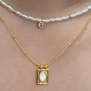 Collana di perline rotonde chic estive con accenti di perle e diamanti