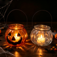 Pot à bougie en verre en forme de citrouille avec poignée en métal pour la décoration d'ambiance du festival d'Halloween