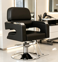 Chaise de salon professionnelle pour coiffeur, en cuir PU noir de luxe, avec repose-pieds en métal et accoudoirs réglables hydrauliquement.