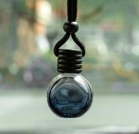 Diffuseur d'huiles essentielles pour voiture avec logo laser, flacon en verre de 8 ml, à suspendre au rétroviseur, parfum pour voiture, vente en gros