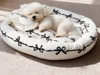 Lit pour chien et chat en peluche moderne, mignon et apaisant, en forme de beignet, avec tapis intégré