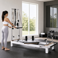 Reformer de Pilates en alliage d'aluminium avec barre de pieds réglable et ressorts, design compact et peu encombrant pour la maison, la salle de sport et l'entraînement en studio