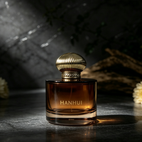 Flacon de parfum en verre rose rond épais de 50 ml, nouveau design, avec bouchon pompe transparent et boîte d'emballage cosmétique ronde verte, vente en gros