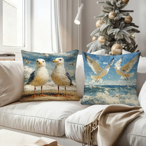 Des coussins décoratifs sur le thème des mouettes ornent un canapé confortable avec des chaussettes de Noël festives en arrière-plan. - Product Image 4