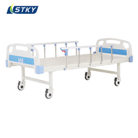 Lit d'hôpital manuel standard pour patient, lit médical simple avec matelas, barrière de sécurité et table à manger pour clinique