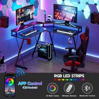 Bureau de jeu d'ordinateur en forme de L avec prises de courant et lumières LED Support de moniteur et étagère de rangement Bureau d'angle pour bureau à domicile