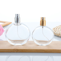 Flacon de parfum élégant, forme plate et ronde, flacon en verre pour parfum avec bouchon transparent de luxe, flacon pulvérisateur de parfum en verre de 100 ml