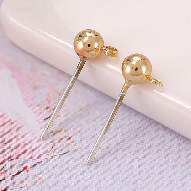 Bague croix dorée KC