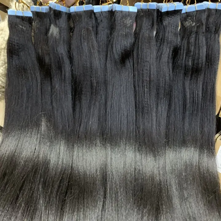 असंसाधित भारतीय घुंघराले टेप बाल विस्तार में अदृश्य थोक प्राकृतिक Yaki सीधे टेप बाल एक्सटेंशन 100% मानव बाल