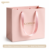 Sac cadeau en papier carré personnalisé OEM de luxe avec ruban satiné estampé à l'or rose pour boutique de cosmétiques et de beauté