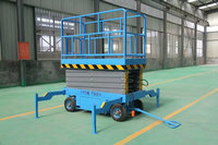 Plateforme élévatrice mobile à ciseaux avec système de déplacement manuel et mécanisme de levage hydraulique