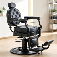 Chaise de coiffure noire gothique, cuir capitonné rond, accoudoirs en métal mat et base circulaire sur pied.