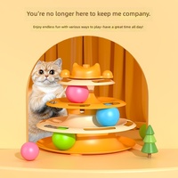 Jouet tournant pour chat à quatre niveaux avec plumes, balles et piste interactive en plastique pour jeu en intérieur