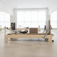 Reformer de Pilates professionnel en bois d'érable avec système de barre de pieds réglable intégré et cadre en bois d'érable plus épais