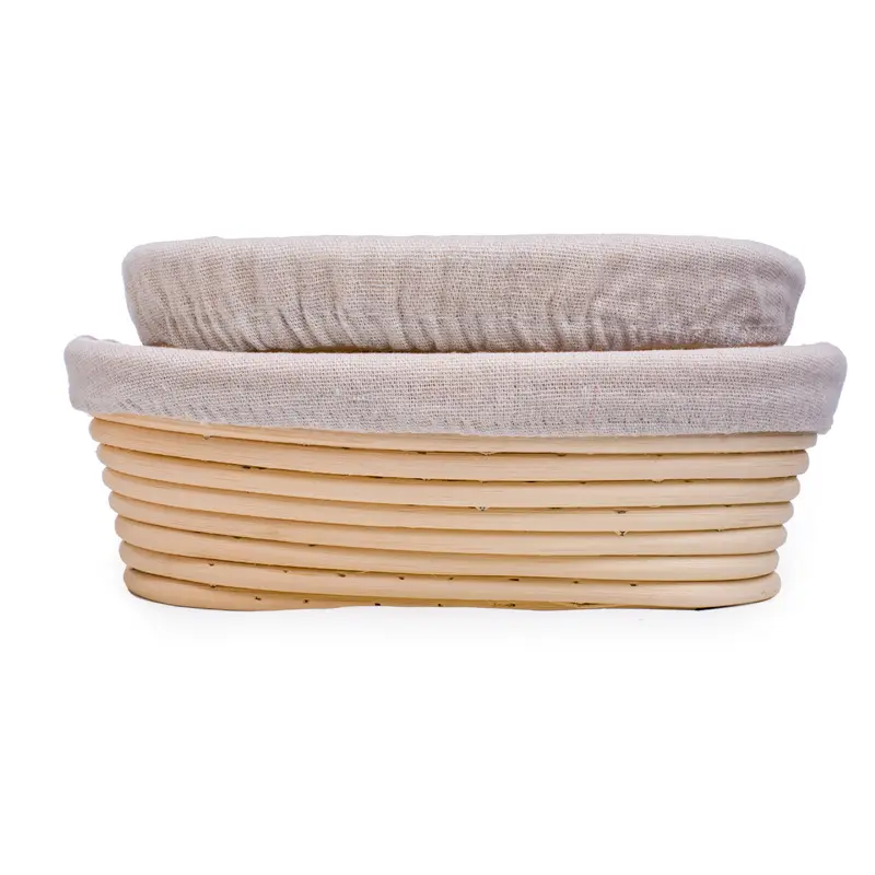 Vente en gros Fait à la main en rotin naturel ovale de 9 pouces cuisson panier à pâte chauffante avec doublure bol en rotin durable