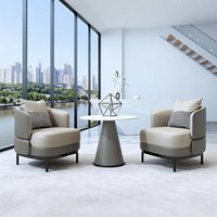 Salon d'accueil professionnel, espace de réunion pour clients, bureau de vente et ensemble table et chaises pour discussions décontractées.