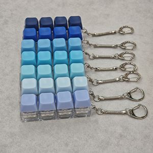 Porte-clés mécanique carré à quatre touches, anti-stress, en PVC, couleurs macaron, jouet coloré, vente en gros, best-seller - Product Image 3