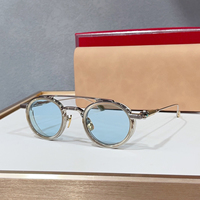 Lunettes de soleil unisexes rétro rondes de luxe, monture noire à double pont, protection UV400, idéales pour la conduite, les voyages et les soirées.