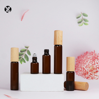 Flacon à bille en verre ambré écologique avec bouchon en bambou, sérigraphié et estampé or, vide, pour cosmétiques et huiles essentielles