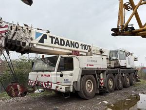 รถเครนติดรถบรรทุก Tadano มือสอง ปี 2003 รับน้ำหนักได้ 110 ตัน ความสูงยก 52 เมตร เครื่องยนต์ Mercedes-Benz สีขาวลายแดง - Product Image 2