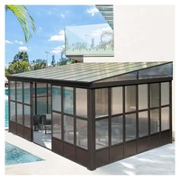 Véranda contemporaine de luxe en aluminium avec structure isolée et verre trempé rétractable pour jardin d'hiver