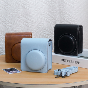 Sac en cuir PU pour appareil photo instantané pour <span class=keywords><strong>Instax</strong></span> <span class=keywords><strong>Mini</strong></span> <span class=keywords><strong>40</strong></span> sac en cuir PU avec poche et bandoulière réglable - Product Image 1